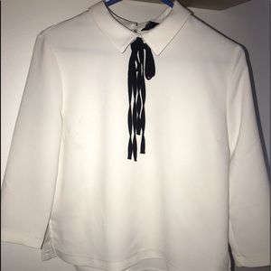 White blouse with black strings